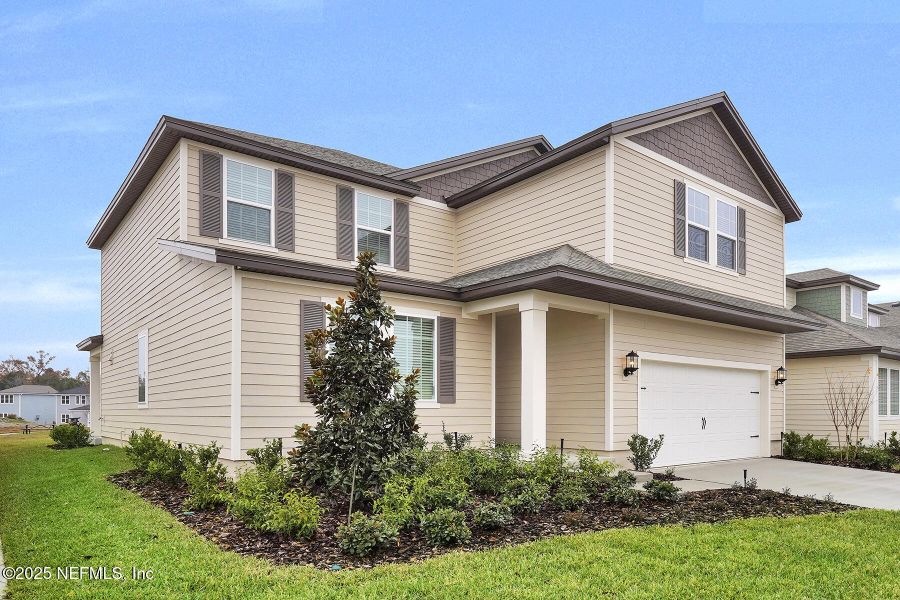 Front exterior of a new home in Jennings Farm, Middleburg, FL, highlighting curb appeal (Image 18).