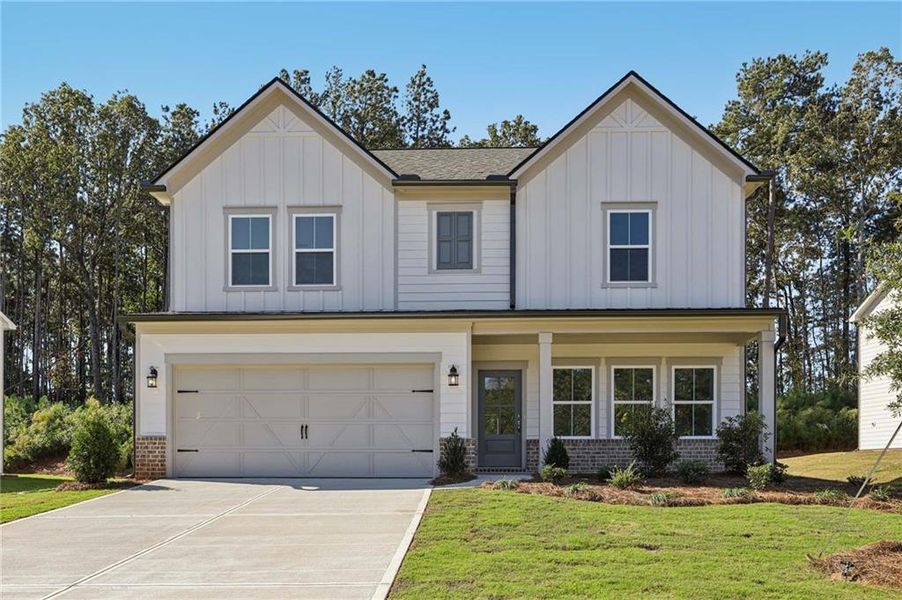 Front exterior of a new home in The Pointe at Heron Bay, Locust Grove, GA, highlighting curb appeal (Image 18).