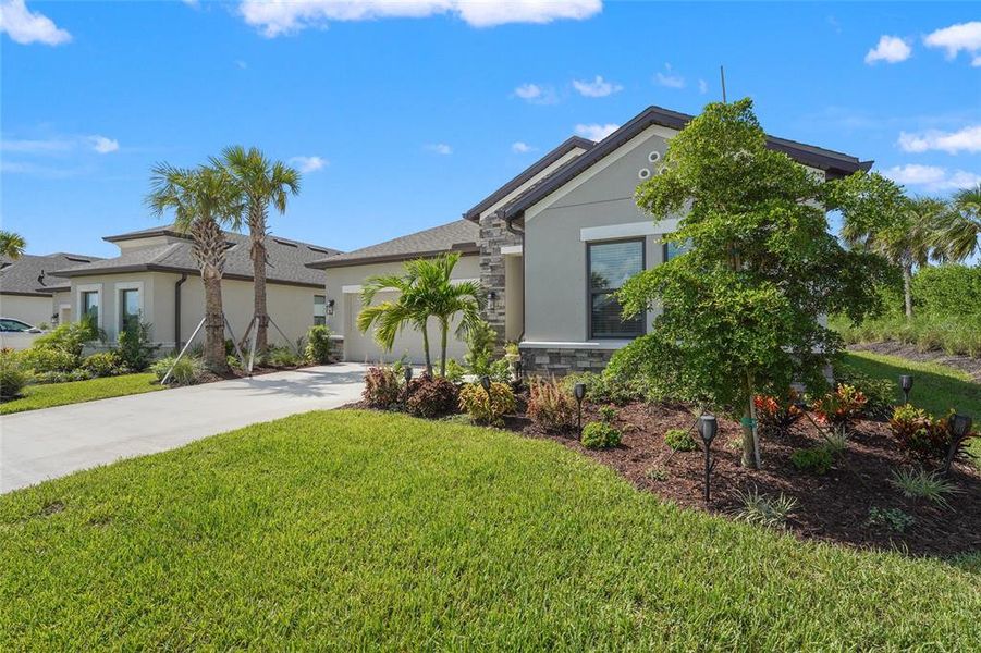 Front exterior of a new home in , Nokomis, FL, highlighting curb appeal (Image 22). Front exterior of a new home in , Nokomis, FL, highlighting curb appeal (Image 22).