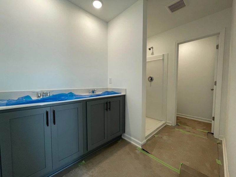 Primary Bath featuring the AW Collection® Minimalist - Sleek finishes and dramatic contrasts shine. Primary Bath featuring the AW Collection® Minimalist - Sleek finishes and dramatic contrasts shine.