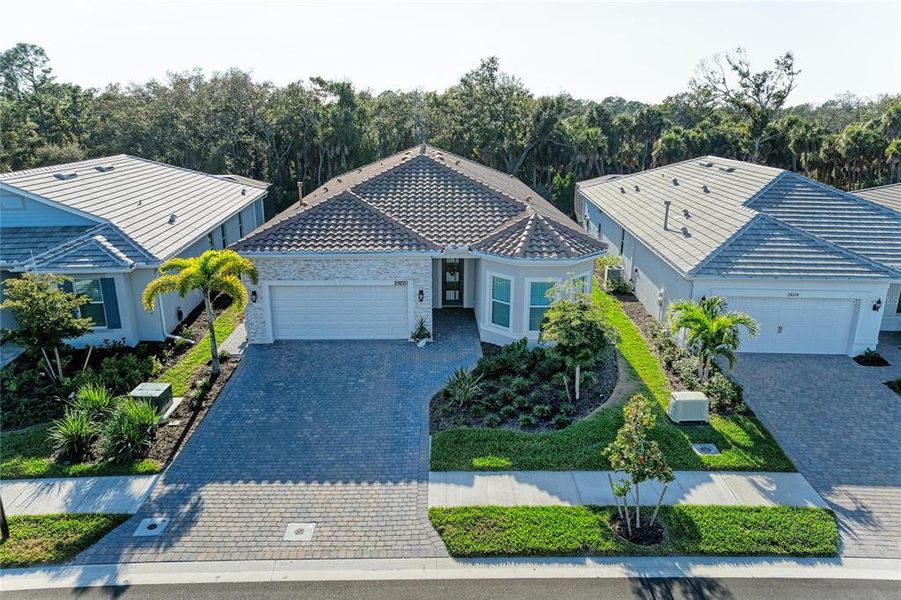 Front exterior of a new home in , Englewood, FL, highlighting curb appeal (Image 1). Front exterior of a new home in , Englewood, FL, highlighting curb appeal (Image 1).