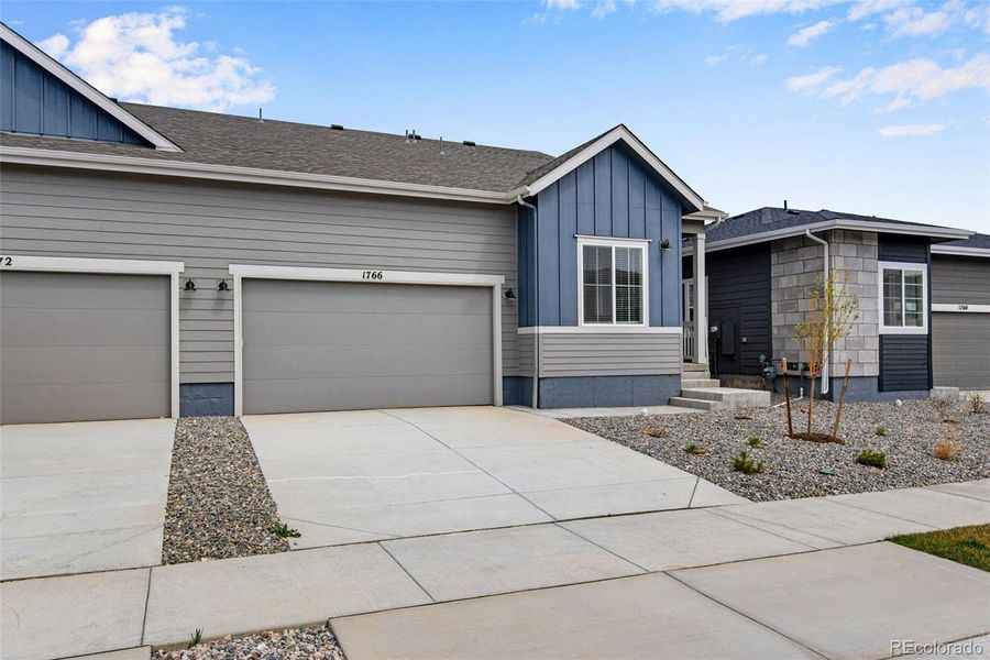 Front exterior of a new home in , Berthoud, CO, highlighting curb appeal (Image 24).