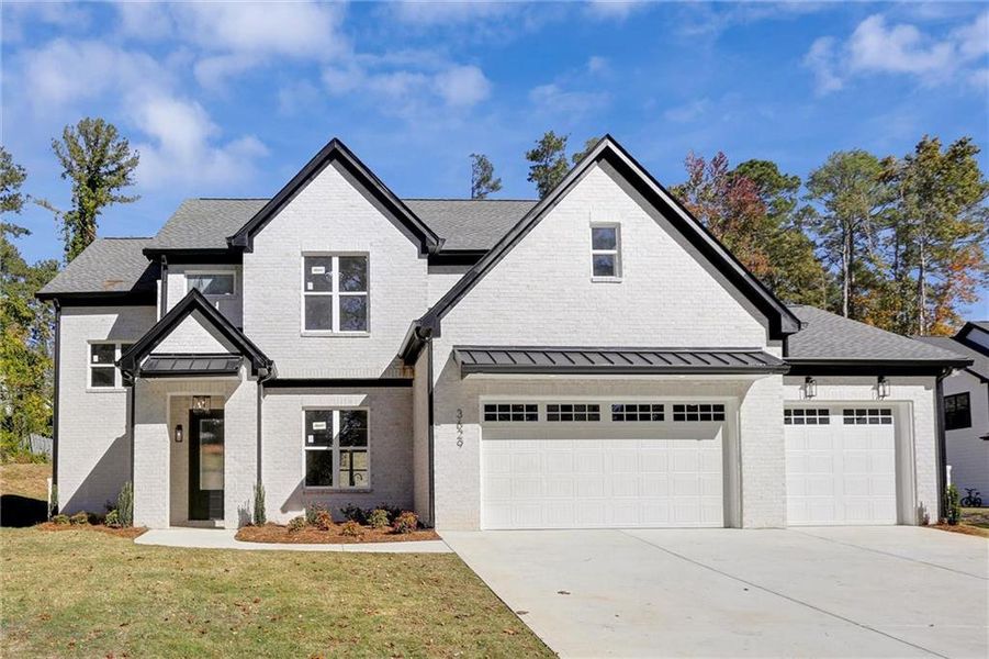 Front exterior of a new home in , Snellville, GA, highlighting curb appeal (Image 1). Front exterior of a new home in , Snellville, GA, highlighting curb appeal (Image 1).
