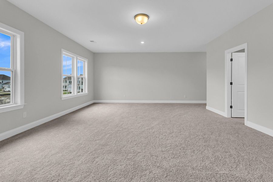 Spacious, unfurnished interior of a new home in Tidewater at Lakes of Cane Bay, Summerville (Image 42).