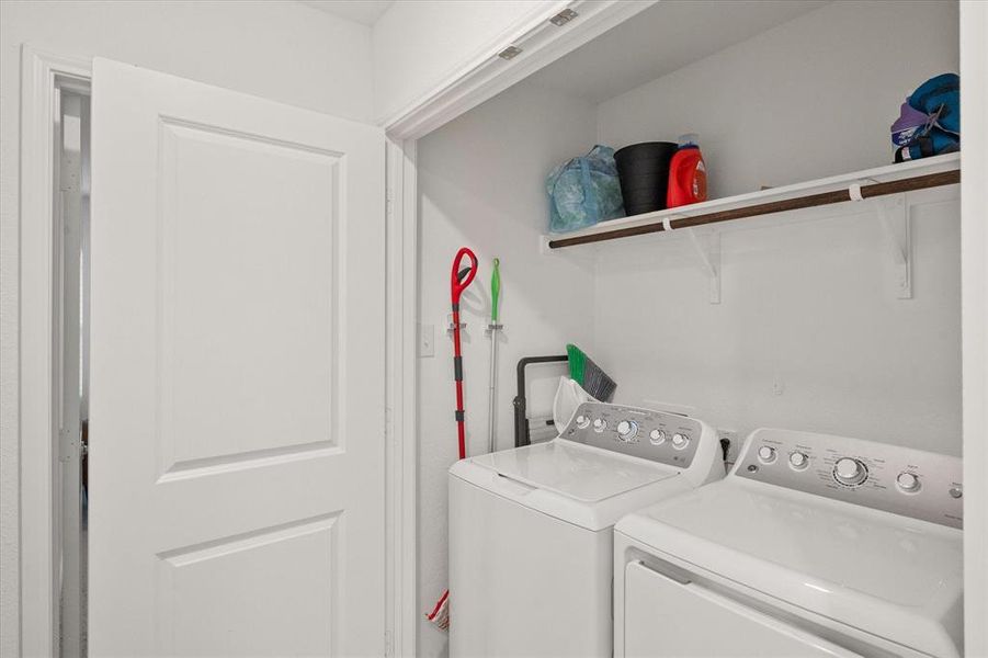 Laundry area with washing machine and clothes dryer