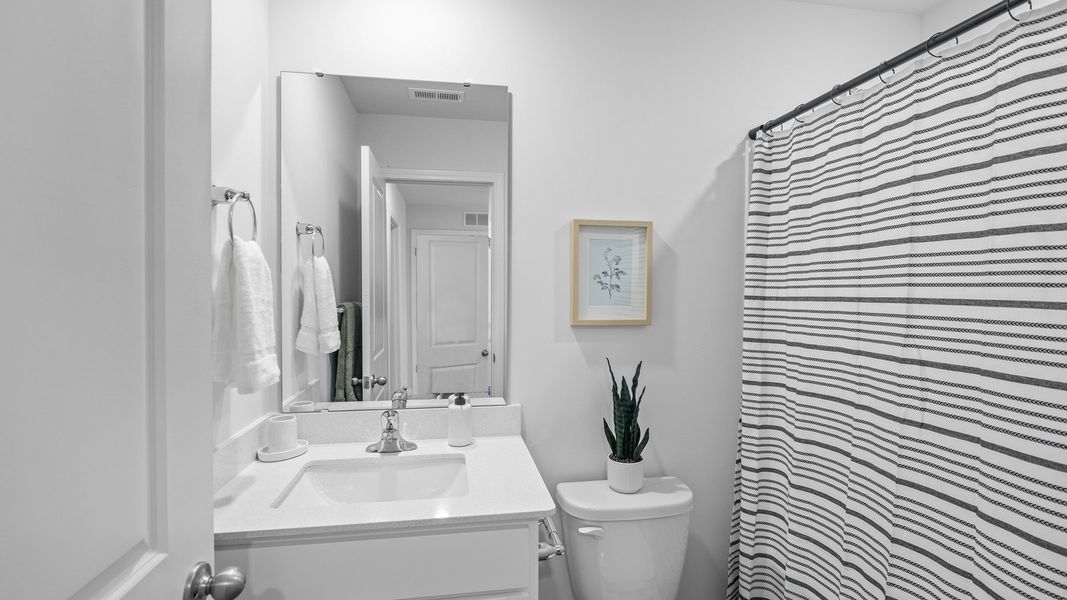 Furnished interior view inside a new home in The Townes at Ridgewood Farms, Winterville (Image 19).