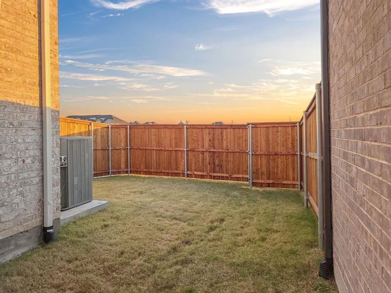 Yard at dusk with central AC