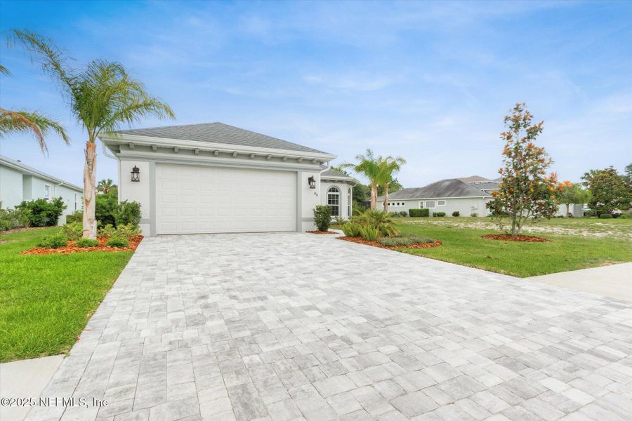 Front exterior of a new home in , Palm Coast, FL, highlighting curb appeal (Image 24). Front exterior of a new home in , Palm Coast, FL, highlighting curb appeal (Image 24).