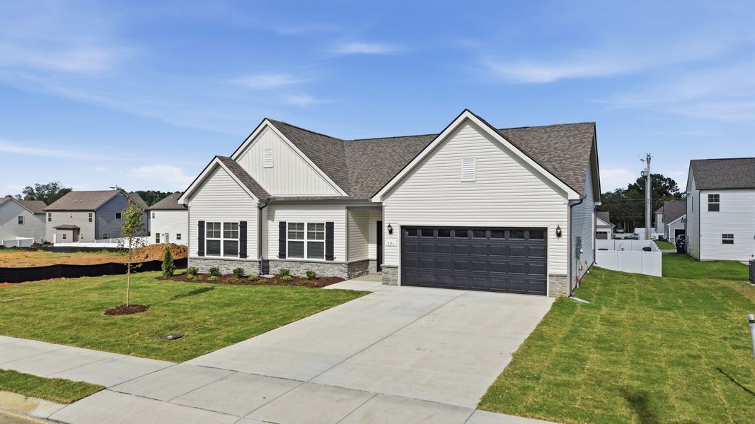Front exterior of a new home in Wheatfield, Shelbyville, TN, highlighting curb appeal (Image 21).