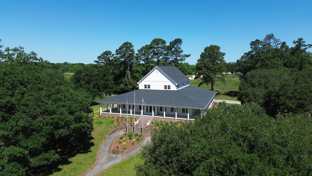Front exterior of a new home in The Forest at Black Bear, Longs, SC, highlighting curb appeal (Image 17).