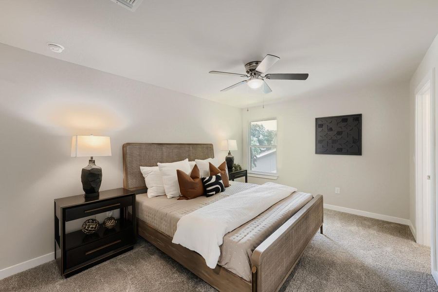 A tranquil bedroom retreat features a window and ceiling fan for optimal comfort. A tranquil bedroom retreat features a window and ceiling fan for optimal comfort.