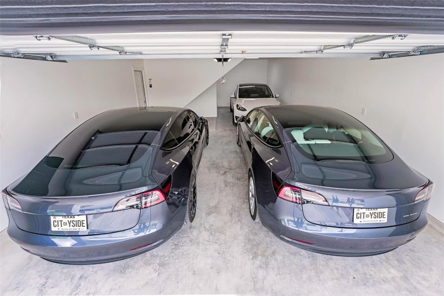 Three car tandem garage. Space for 5 vehicles with private driveway Three car tandem garage. Space for 5 vehicles with private driveway