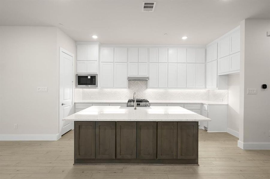 Furnished interior view inside a new home in The Abbey at Mercer Crossing, Farmers Branch (Image 7).