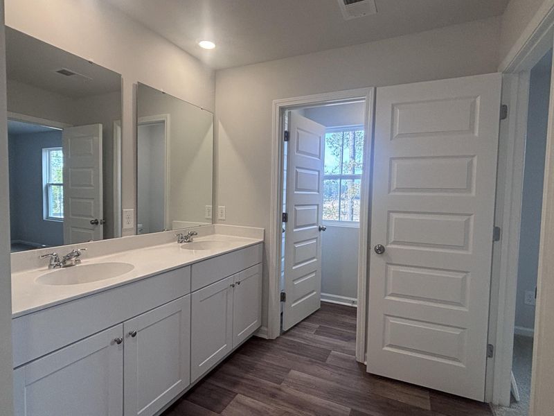 Furnished interior view inside a new home in Lindera Preserve at Cane Bay Plantation: Townhomes, Summerville (Image 9). Furnished interior view inside a new home in Lindera Preserve at Cane Bay Plantation: Townhomes, Summerville (Image 9).