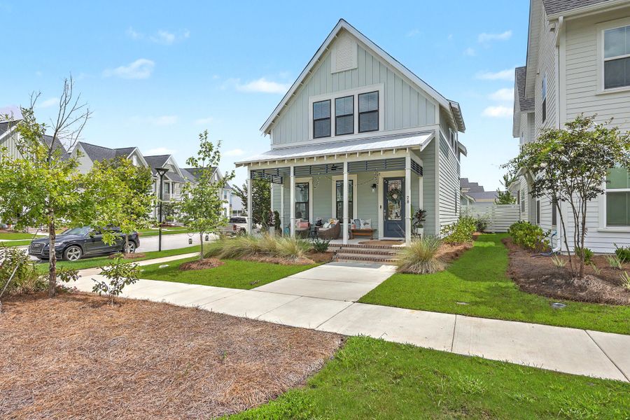 Front exterior of a new home in Nexton - Midtown, Summerville, SC, highlighting curb appeal (Image 2). Front exterior of a new home in Nexton - Midtown, Summerville, SC, highlighting curb appeal (Image 2).