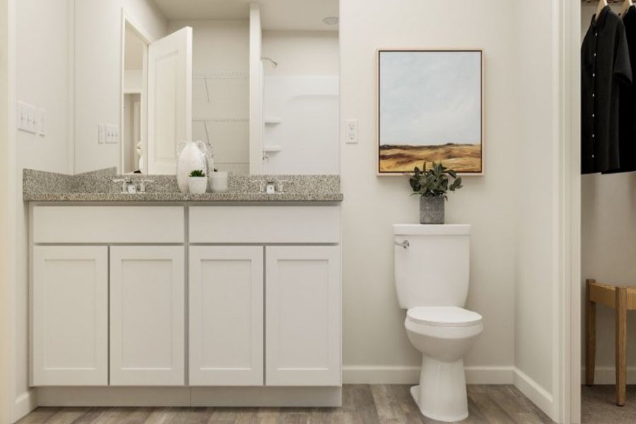 A bathroom with a toilet and sink.