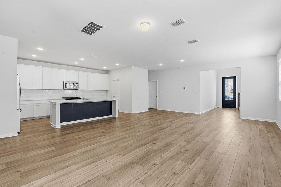 An open concept design seamlessly connects the generous living area with a contemporary kitchen. An open concept design seamlessly connects the generous living area with a contemporary kitchen.