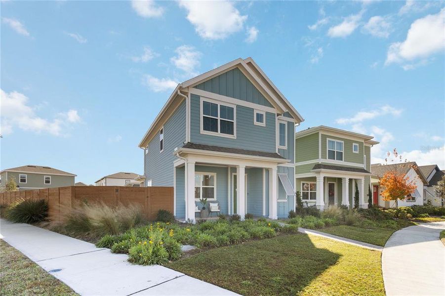 Front exterior of a new home in Weslyn Park at Sunbridge (Craft Homes), St. Cloud, FL, highlighting curb appeal (Image 21).