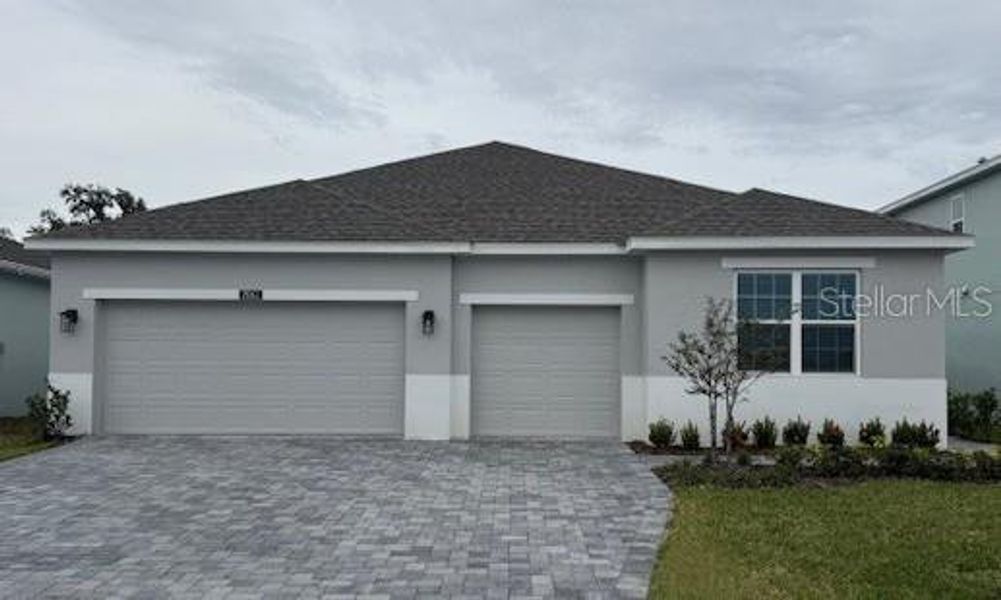 Front exterior of a new home in Storey Creek, Kissimmee, FL, highlighting curb appeal (Image 12). Front exterior of a new home in Storey Creek, Kissimmee, FL, highlighting curb appeal (Image 12).