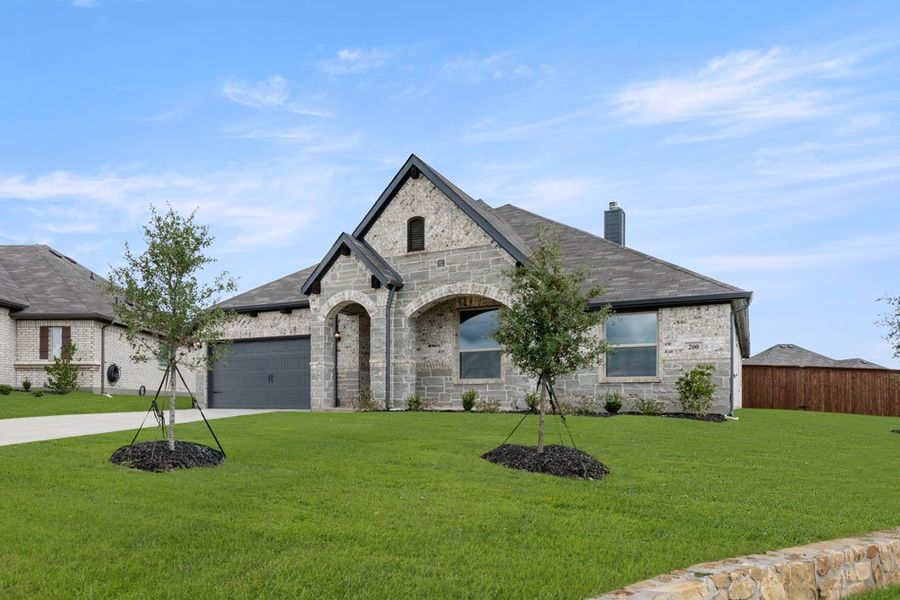 Representative exterior photo of a completed home built from the Balmoral by Impression Homes in Timberbrook, Justin, TX (Image 2).