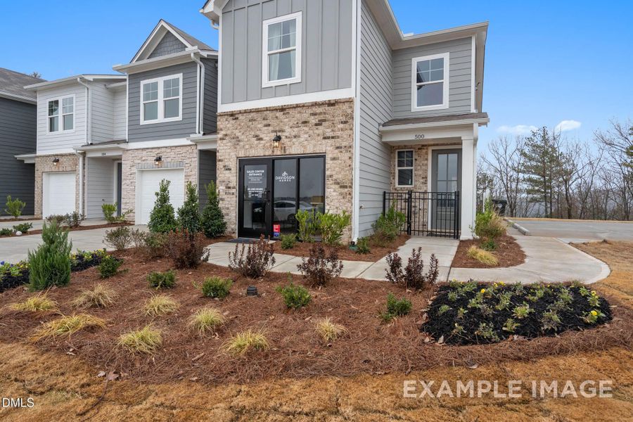 Front exterior of a new home in Townes at North Main, Lillington, NC, highlighting curb appeal (Image 1). Front exterior of a new home in Townes at North Main, Lillington, NC, highlighting curb appeal (Image 1).