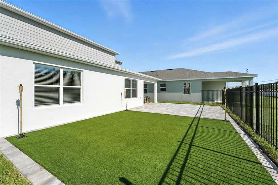 Exterior details and patio area of a home in Amelia Groves, St. Cloud (Image 24).