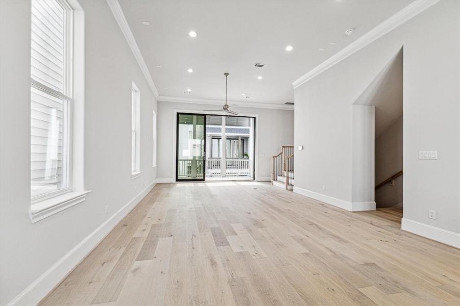 White Oak Wood Flooring, Soaring 12 FT Ceilings, Show Stopping 10 FT Tall Tri-Paneled Sliding Glass Doors