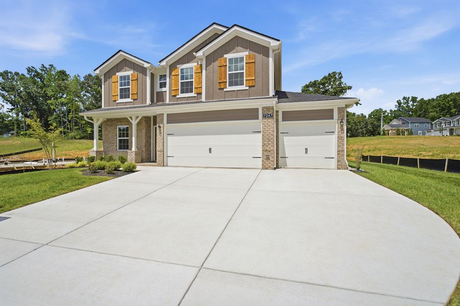 Front exterior of a new home in Brush Creek, Fairview, TN, highlighting curb appeal (Image 2). Front exterior of a new home in Brush Creek, Fairview, TN, highlighting curb appeal (Image 2).