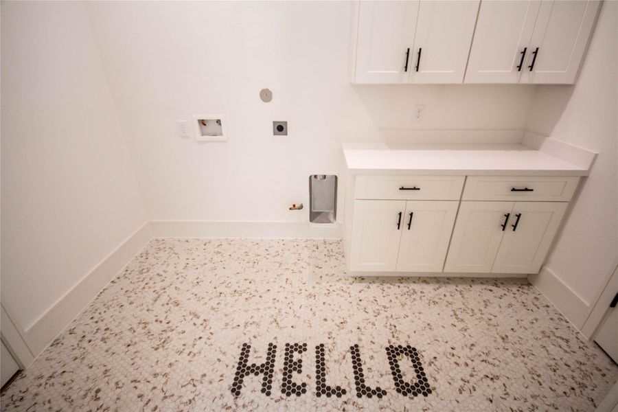 The Primary Closet features a door that leads directly into the laundry room, enhancing convenience for the Primary Suite. Whether you’re coming from the garage or the closet, this thoughtful design makes the laundry area feel inviting and homey, creating a warm welcome each time you walk through. The Primary Closet features a door that leads directly into the laundry room, enhancing convenience for the Primary Suite. Whether you’re coming from the garage or the closet, this thoughtful design makes the laundry area feel inviting and homey, creating a warm welcome each time you walk through.