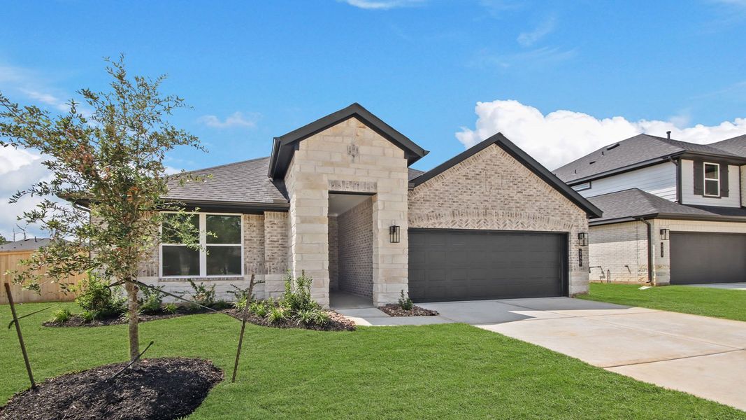 Front exterior of a new home in Hills of Westlake, Conroe, TX, highlighting curb appeal (Image 19). Front exterior of a new home in Hills of Westlake, Conroe, TX, highlighting curb appeal (Image 19).