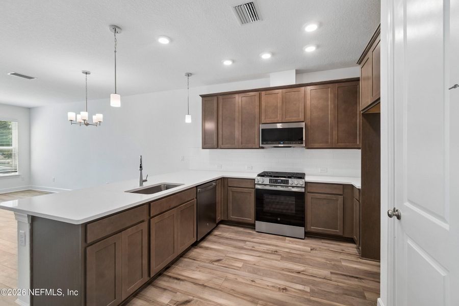 Furnished interior view inside a new home in Westerly Park at Wildlight – Overlook Collection, Yulee (Image 12).