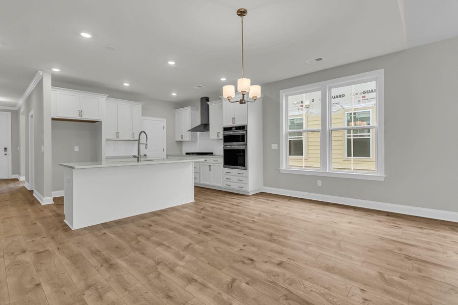 Spacious, unfurnished interior of a new home in Tidewater at Lakes of Cane Bay, Summerville (Image 14).