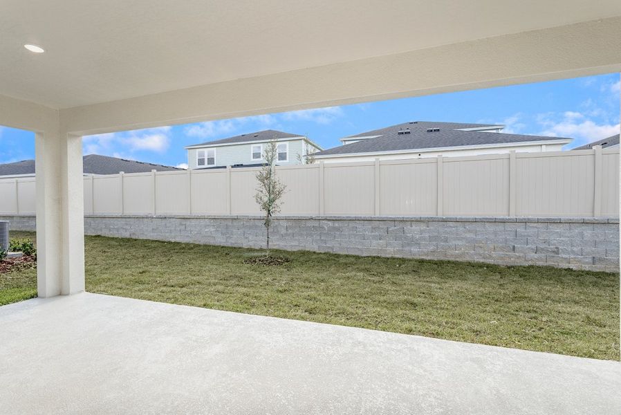 Exterior details and patio area of a home in Pasadena Woods, Dade City (Image 3).