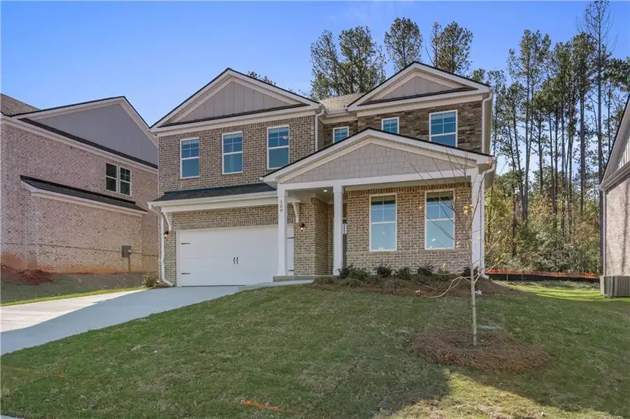 Front exterior of a new home in Bowers Farm, McDonough, GA, highlighting curb appeal (Image 16). Front exterior of a new home in Bowers Farm, McDonough, GA, highlighting curb appeal (Image 16).