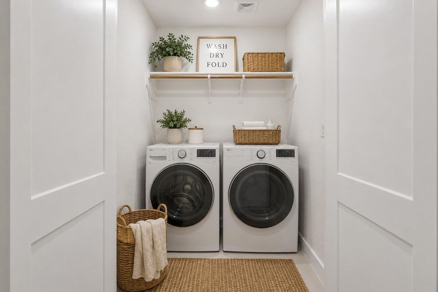 Utility room located on 3rd level. Photo is virtually staged.