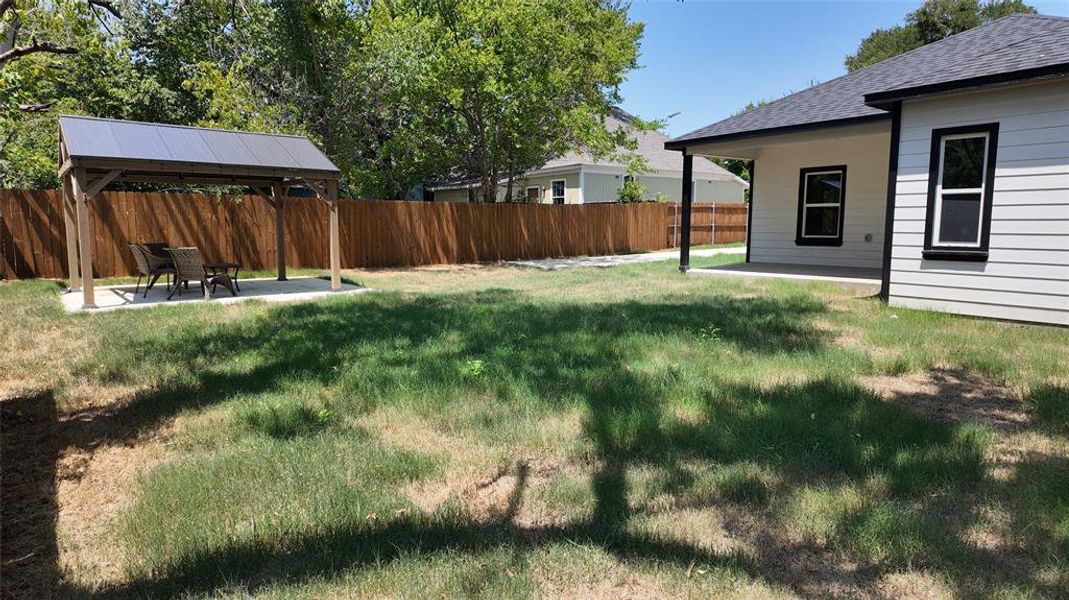 View of yard featuring a patio and a gazebo