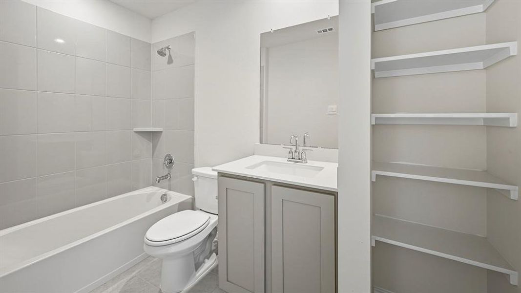Full bathroom featuring  shower combination and vanity