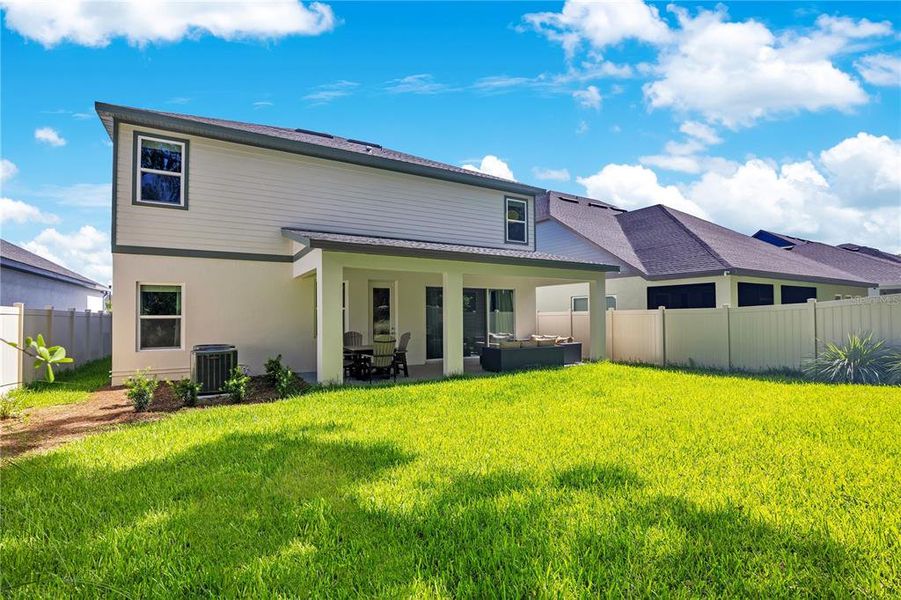Exterior details and patio area of a home in Oakfield at Mount Dora Village Series, Mount Dora (Image 4).