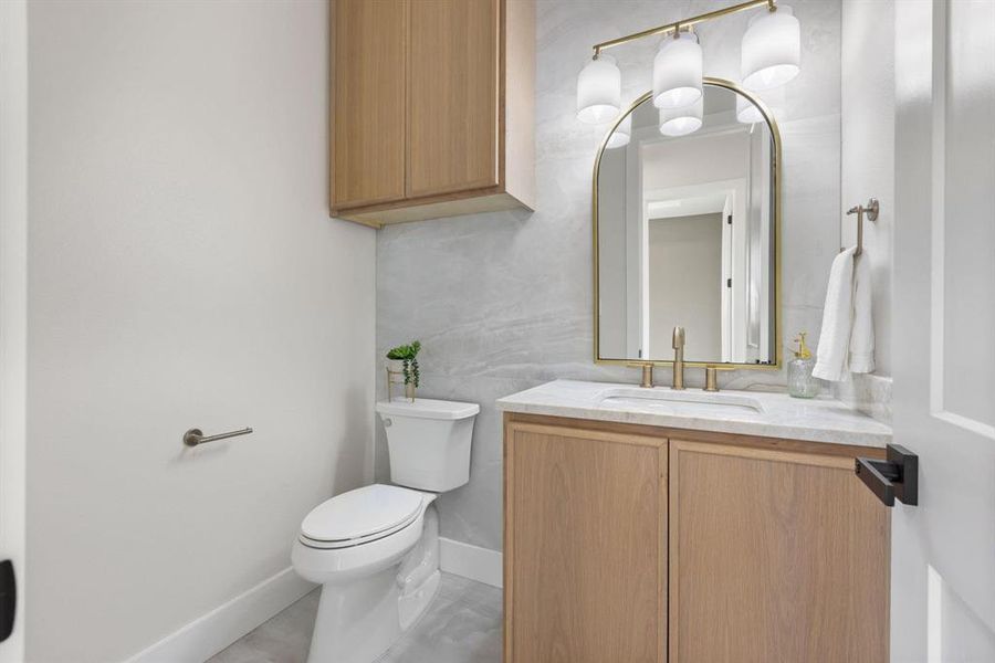 Bathroom featuring vanity and light tile patterned
floors Bathroom featuring vanity and light tile patterned
floors