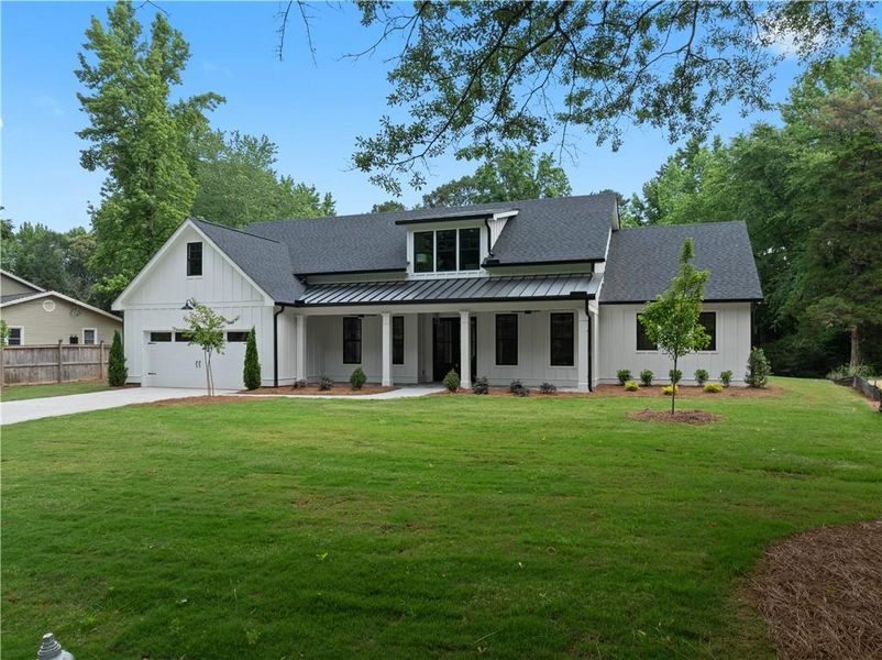 Front exterior of a new home in , Lilburn, GA, highlighting curb appeal (Image 27).