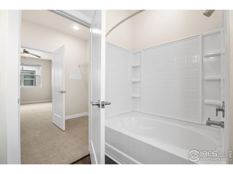 Upstairs bedroom, closet and four piece bathroom.