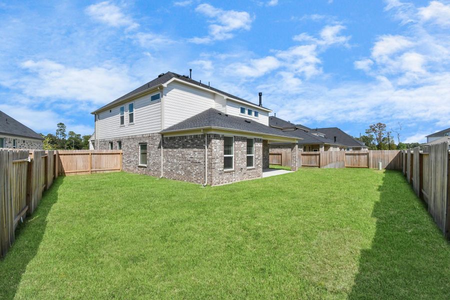 Backyard retreat, offering an abundance of space for kids to play and explore. The possibilities are endless in this outdoor haven, where the joy of open-air activities and family gatherings awaits.