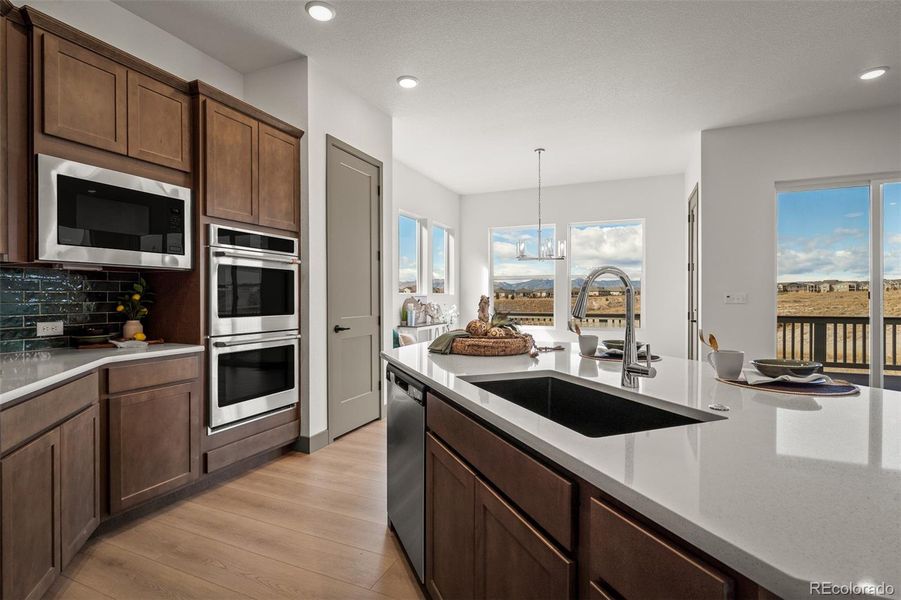 Furnished interior view inside a new home in Revel Crossing at Wolf Ranch - The Panorama Collection, Colorado Springs (Image 6).
