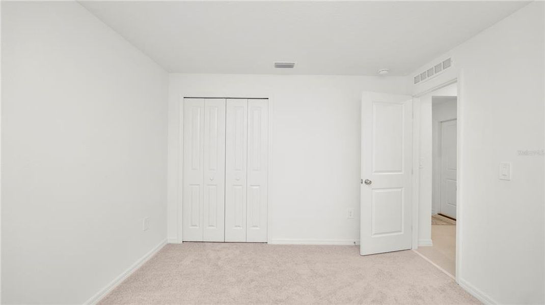 Spacious, unfurnished interior of a new home in Cypress Point at Lake Parker: The Estates, Lakeland (Image 40).