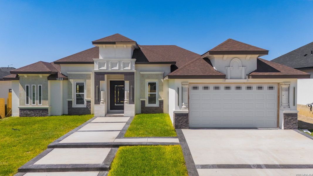Front exterior of a new home in , Eagle Pass, TX, highlighting curb appeal (Image 2). Front exterior of a new home in , Eagle Pass, TX, highlighting curb appeal (Image 2).