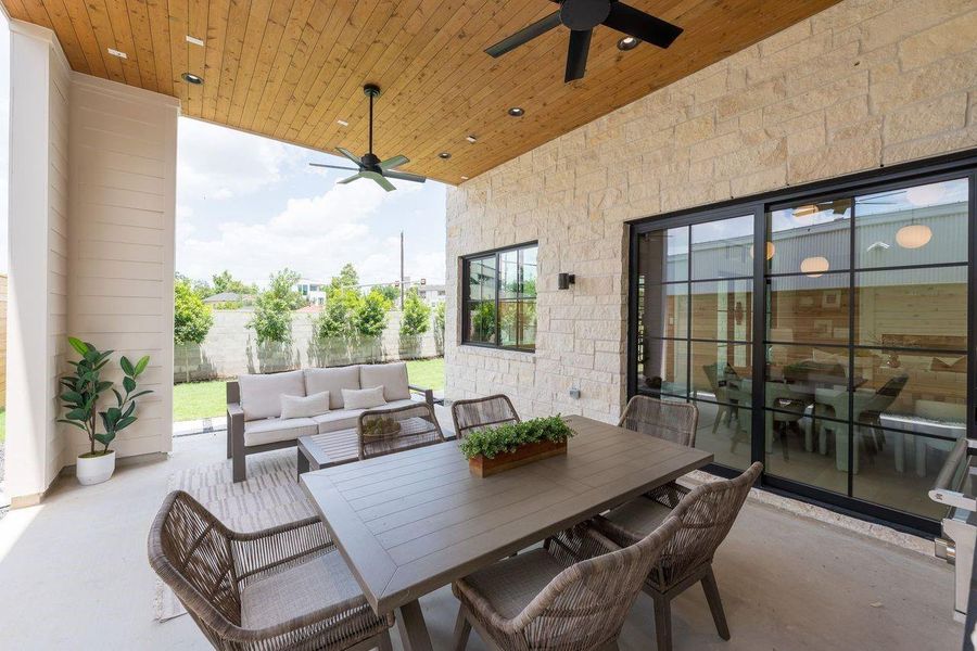 Designed for both quiet mornings and open-air gatherings, this backyard retreat balances tailored hardscape with lush greenery. Elevated planters and structured privacy screening create a serene canvas for relaxation beneath expansive Texas skies.