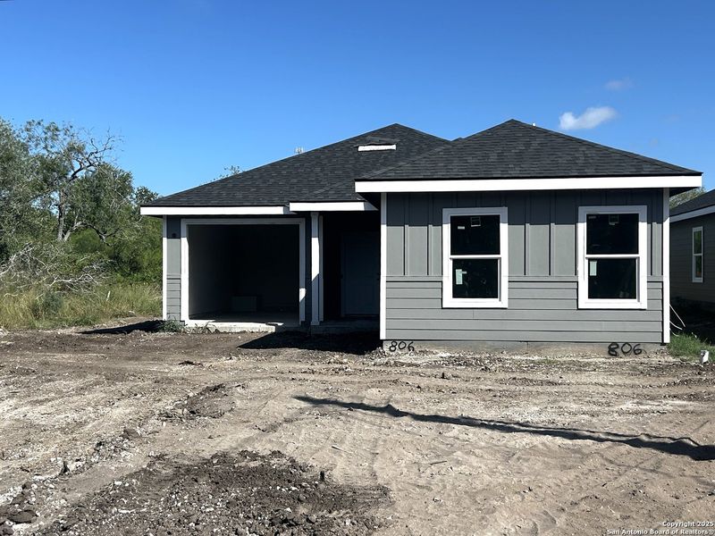 Front exterior of a new home in , Beeville, TX, highlighting curb appeal (Image 2).