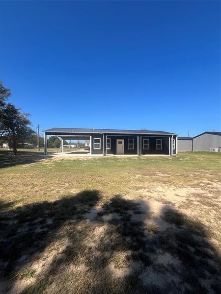 View of front of house with a front lawn and a porch View of front of house with a front lawn and a porch