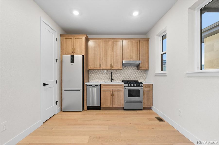Furnished interior view inside a new home in Autograph at Lyric, Lone Tree (Image 12).