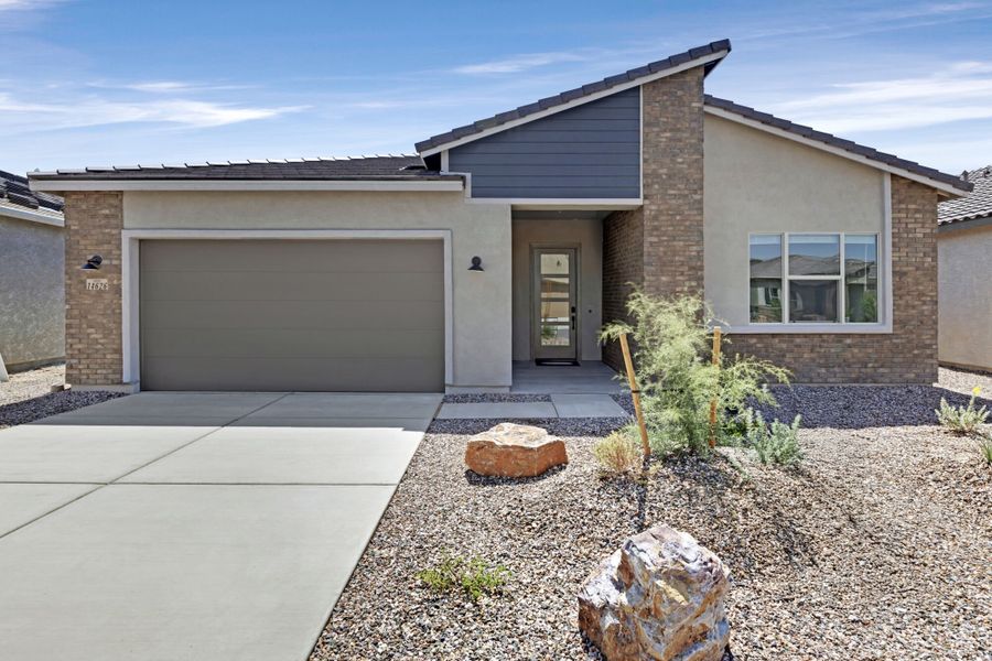 Front exterior of a new home in Saguaro Reserve II, Marana, AZ, highlighting curb appeal (Image 1).